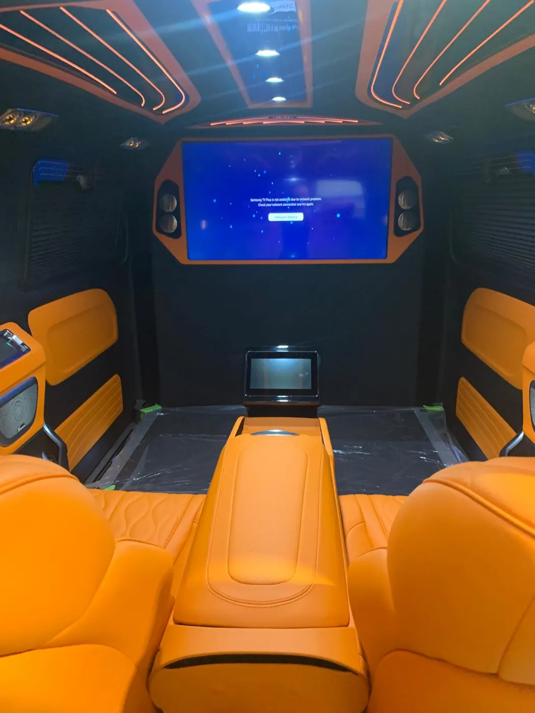 Custom orange leather luxury van interior